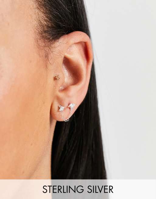 Kingsley Ryan – Dubbelpiercade örhängen i sterlingsilver med kedja och strass