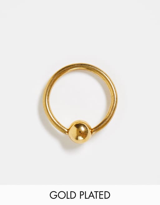 Kingsley Ryan - Navelpiercing in goud