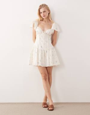 Kiss The Sky Bella flutter sleeve floral mini dress in white