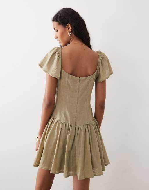 Kiss The Sky Eden textured dropped waist mini dress in sage | ASOS
