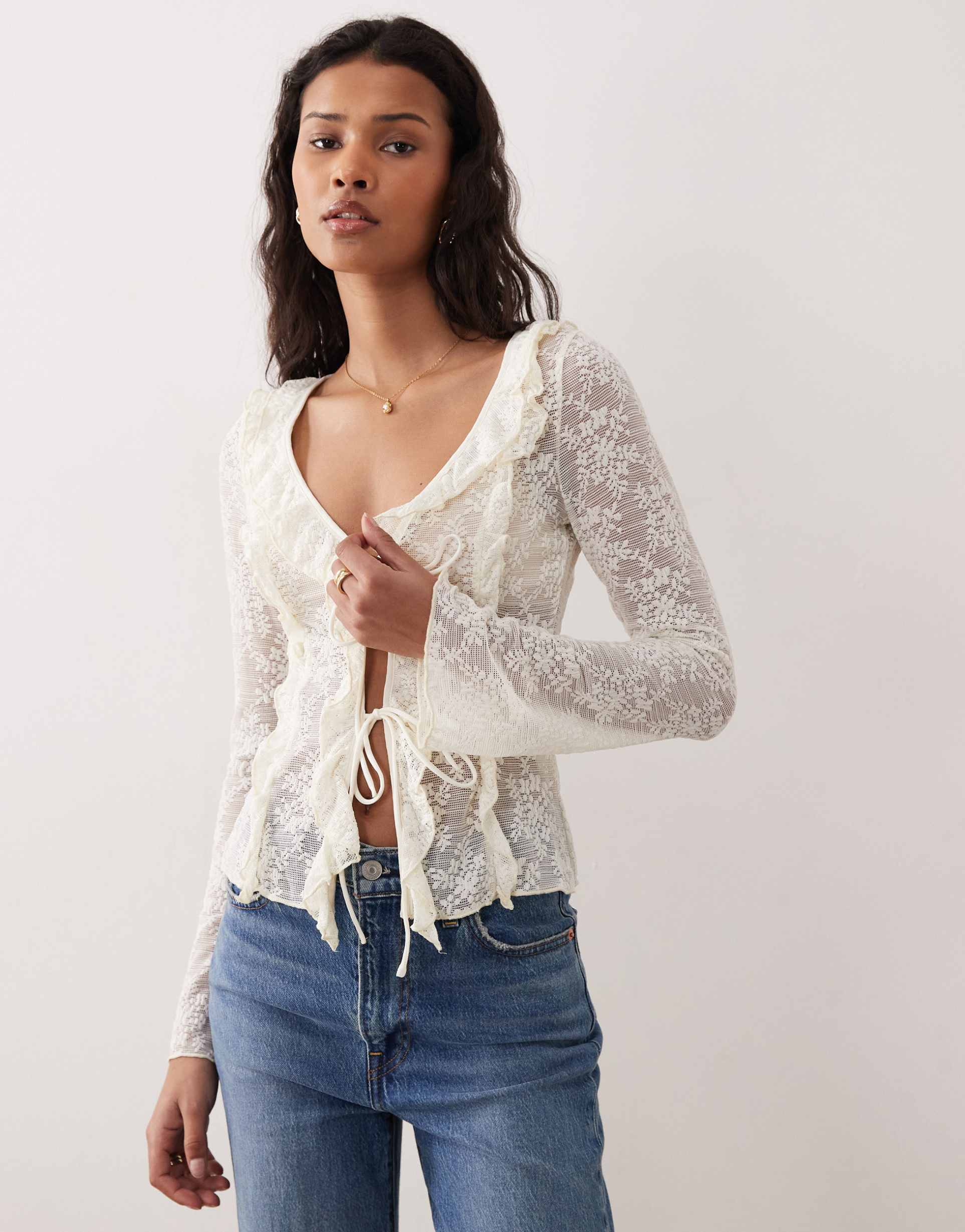kiss the sky lola long sleeve frilly tie up top in cream