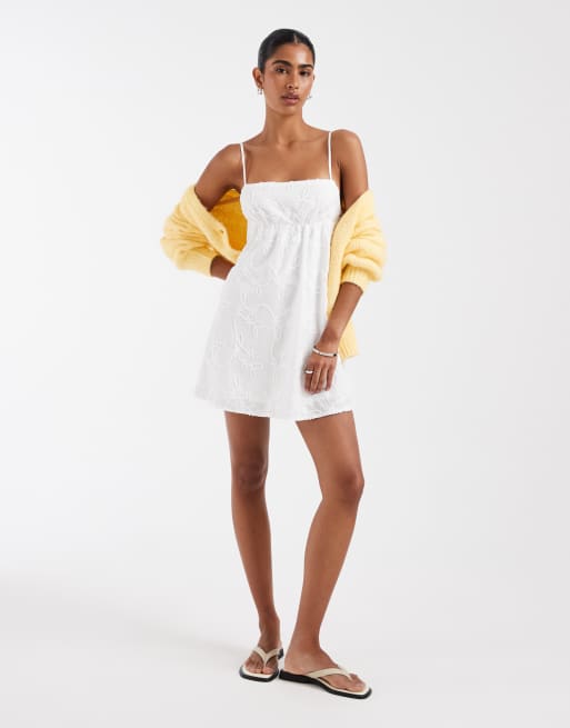 Kiss The Sky Lucie eyelet babydoll mini dress in white | ASOS
