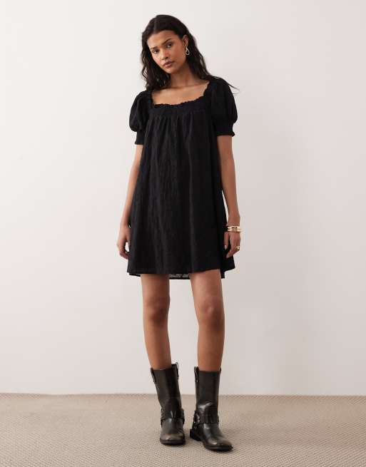 Kiss The Sky Malta short sleeve eyelet babydoll mini dress in black | ASOS