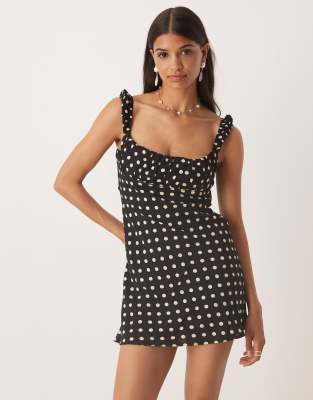 Kiss The Sky - Minikleid in Schwarz mit Punktemuster