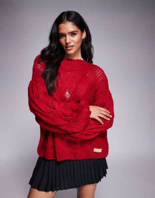 Kiwi & Co - Daydream - Lockerer, handgestrickter Oversize-Pullover in Rot mit Zopfmuster und Ballonärmeln