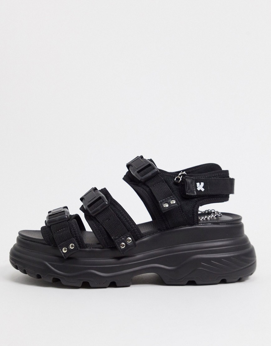 Koi Footwear – Svarta grova sandaler med remmar och spänne