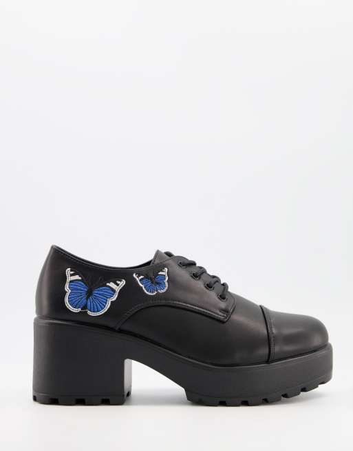 Koi Footwear vegan heeled shoes with blue butterfly in black ASOS