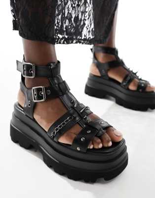 Koi - He Divine - Sandalen in Schwarz mit Stachel-Details und dicker Sohle