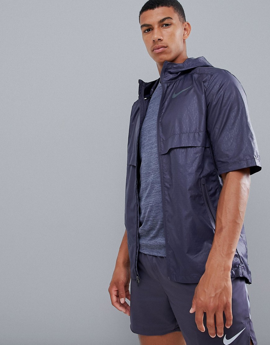 Kortærmet lilla jakke med Just Do It-print 928491-081 fra Nike Running