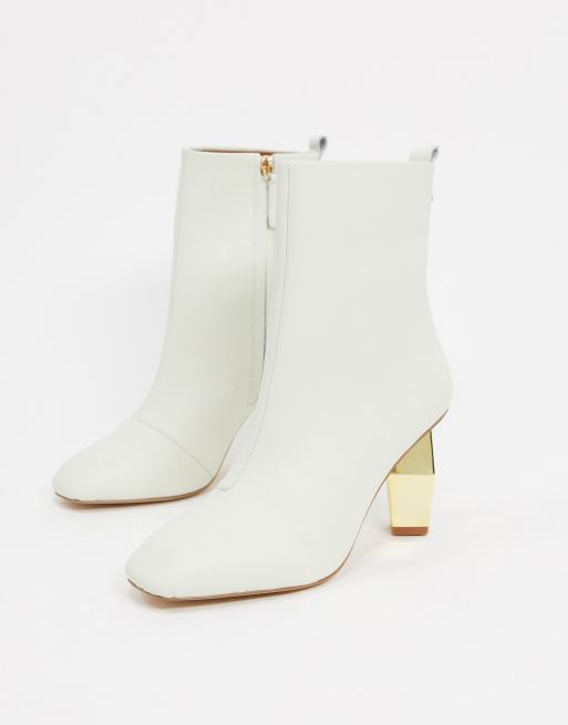 Kurt Geiger Daxon heeled ankle boot with gold heel in white leather