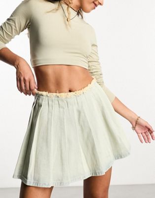 The Brand denim pleated mini skirt with distressed waist in light blue wash