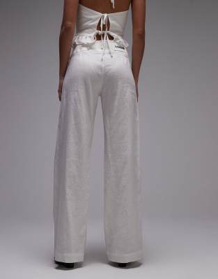 LAAGAM kaine linen mix pants with silver buckle in white - part of a set