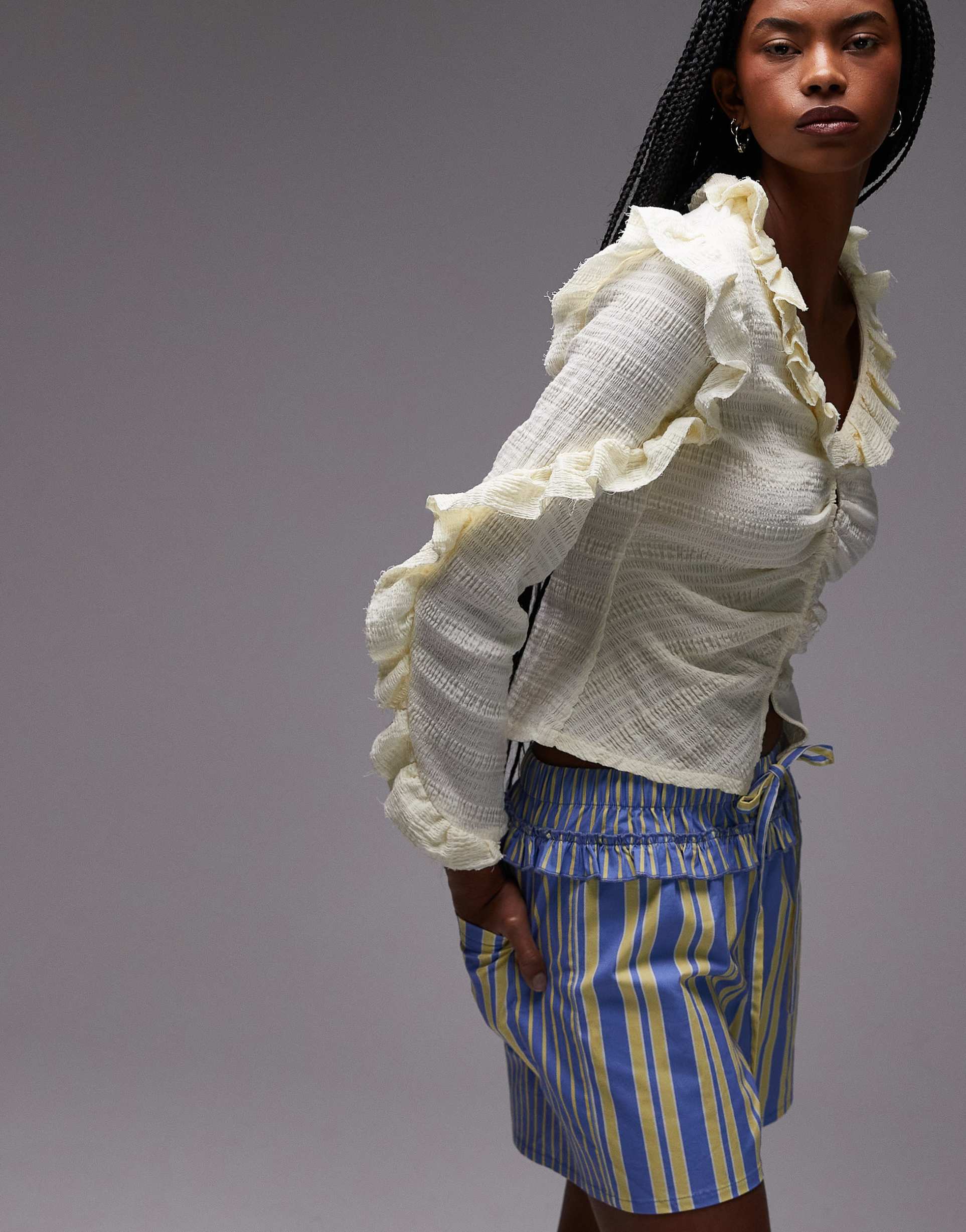 laagam textured ruffle front button up blouse in white