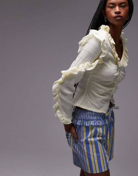 LAAGAM textured ruffle front button up blouse in white