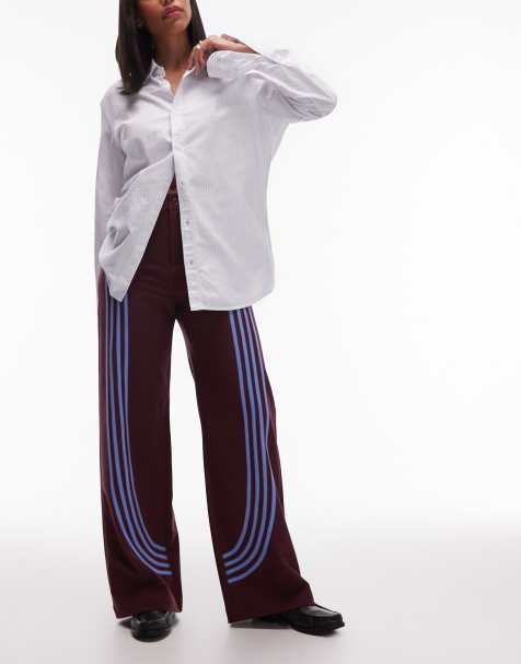 LAAGAM zion midrise straight leg trackpants with curved contrast piping in burgundy