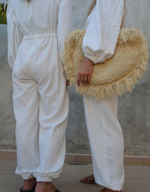 White linen store jumpsuit long sleeve