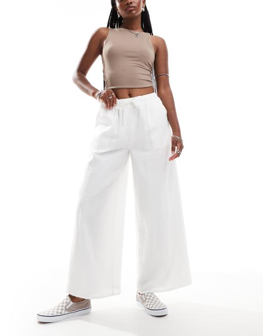 Labelrail x Olivia Grace Herring - Broek met wijde pijpen, lage taille en textuur in wit