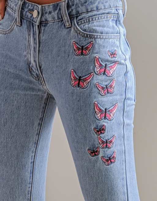 Labelrail x Pose and Repeat mid rise 90s flared jeans with butterfly  appliques in blue