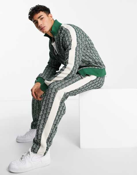 Lacoste all-over print taped track pants in green - view 1