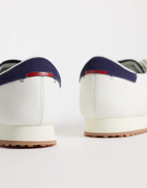 Lacoste aura gumsole trainer in navy and white, 2 of 5