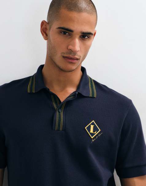Lacoste badge logo polo shirt in navy - view 1