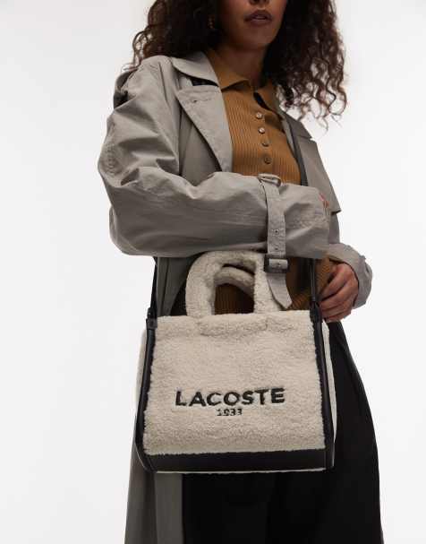 Lacoste – Beige, svart axelremsväska i fårskinnsimitation - view 1