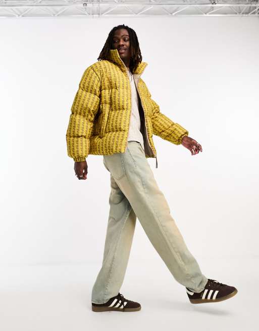 Lacoste – Beige vadderad jacka med abstrakt logga