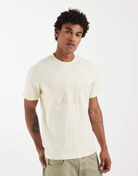 Lacoste – Beżowy T-shirt z małą grafiką z logo - view 1