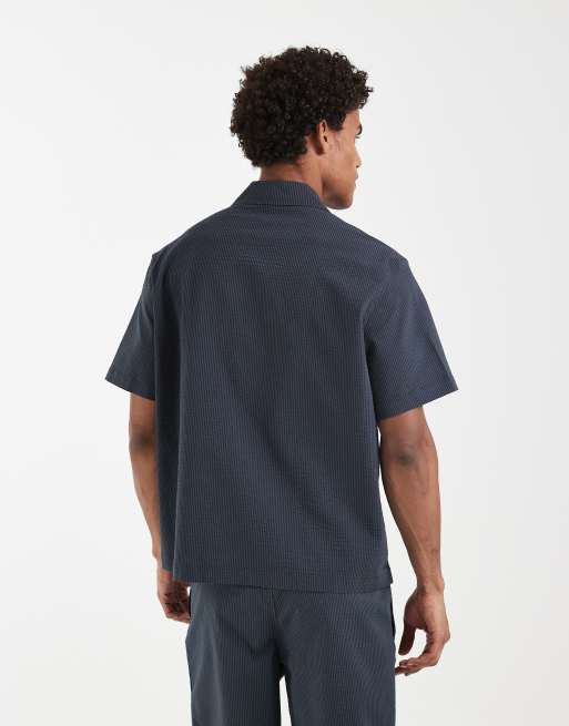 Lacoste – Bleksvart skjorta i bäckebölja med platt krage, del av set, 4 av 5