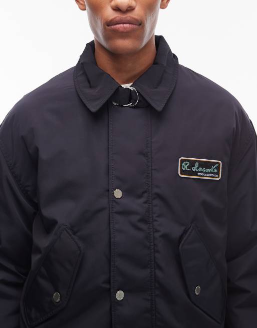 Lacoste – Bomberjacke in Marineblau mit Logo ASOS