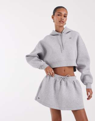 Lacoste bomullsminikjol i grått — kjol med fickor från ASOS
