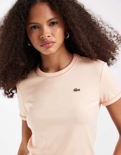 Lacoste – Brzoskwiniowy dopasowany T-shirt z lamówką - view 1
