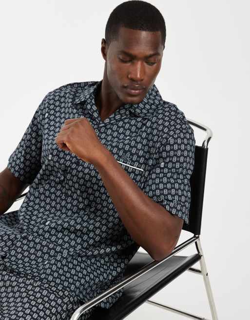 Lacoste - Camicia a maniche corte blu navy con monogramma del logo in coordinato