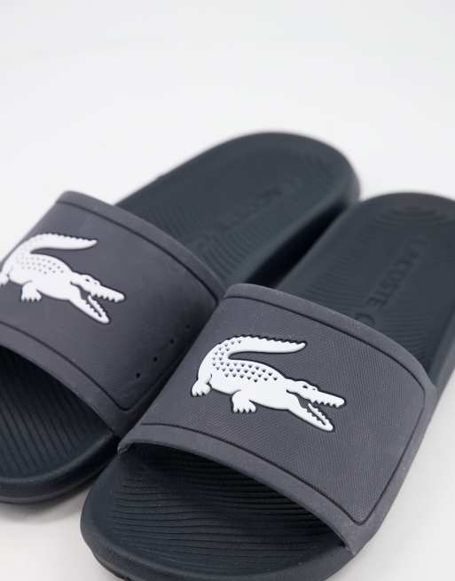 Lacoste — Croco — Marineblå badesandaler ASOS