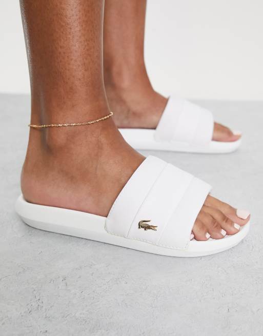 White and 2025 gold lacoste slides