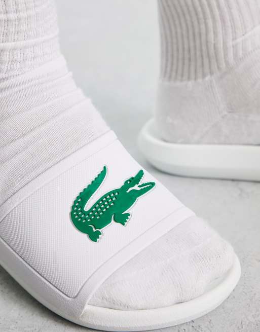 Lacoste store green sliders