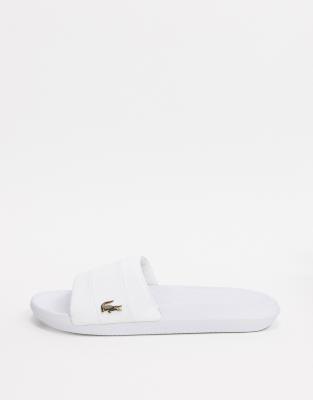 white lacoste sliders mens