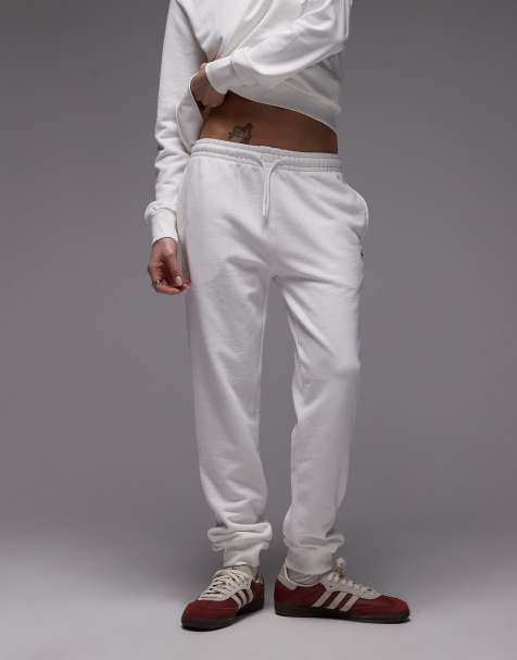 Lacoste cuffed trackies in white - view 1