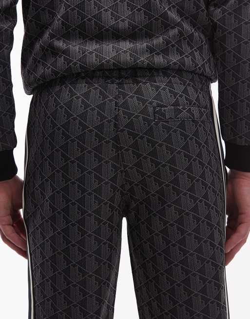 Lacoste – Czarne spodnie dresowe we wzór w monogramy, część zestawu , 4 z 5