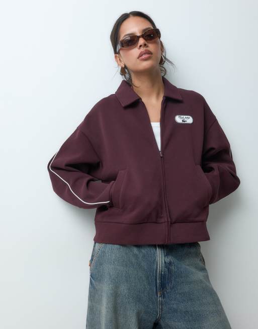 Lacoste felpa in piqué elasticizzato con zip e badge Tennis Heritage bordeaux, 1 di 5