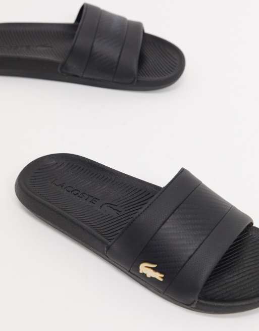 Black and on sale gold lacoste slides