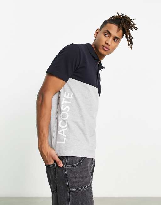 Lacoste – Grå och svart. blockfärgad pikétröja med logga