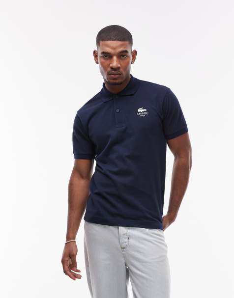 Lacoste polo shirt in navy with white logo print