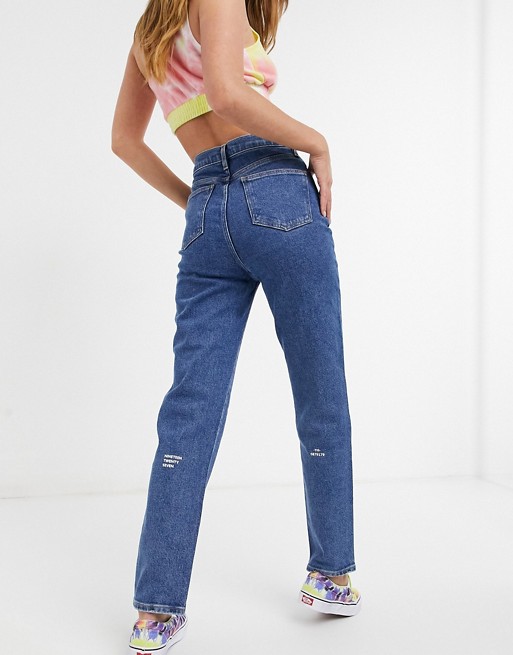 Lacoste high waist straight leg jeans with small printed text detail in mid wash blue