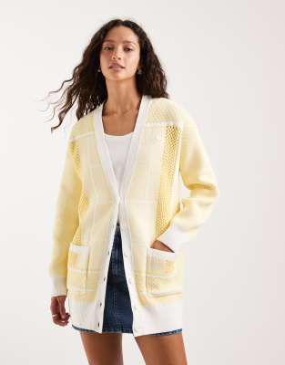 Lacoste - Hochwertige Oversize-Strickjacke in Gelb im Tennis-Design