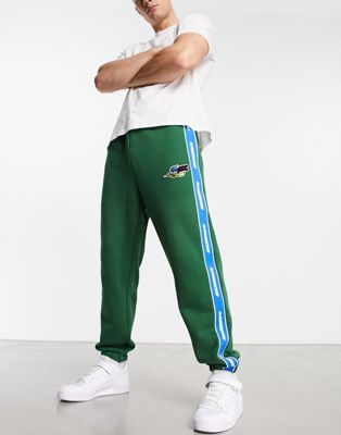 Lacoste Holiday large logo joggers in white