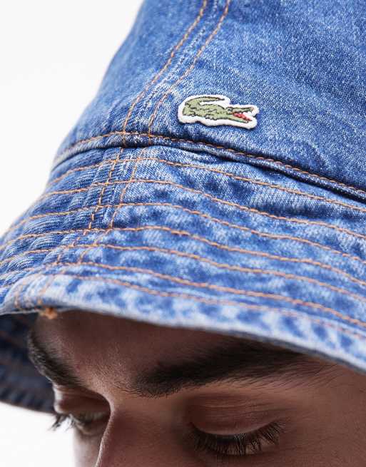 Lacoste – Jeans-Anglerhut in mittelblauer Waschung ASOS