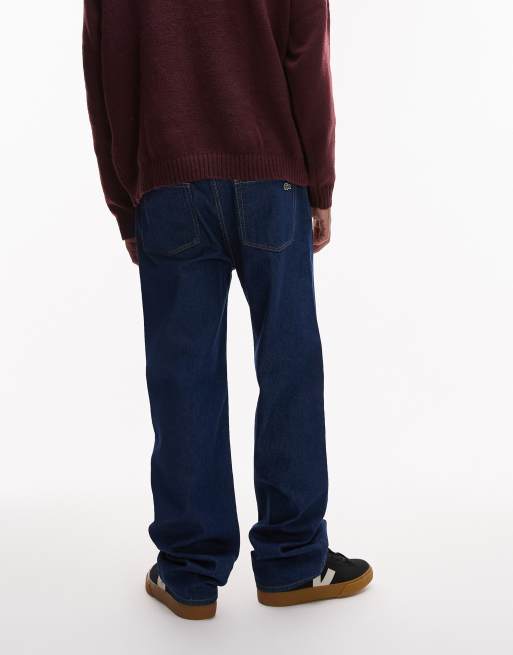 Lacoste – Jeans in dunkler Waschung mit brauner Naht , 4 von 5