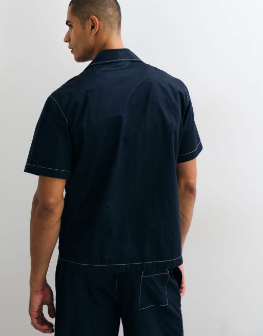 Lacoste kortärmad pikétröja med knappar och logga i navy, 5 av 5