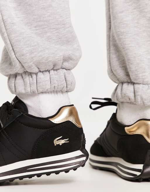 Lacoste shoes best sale black and gold